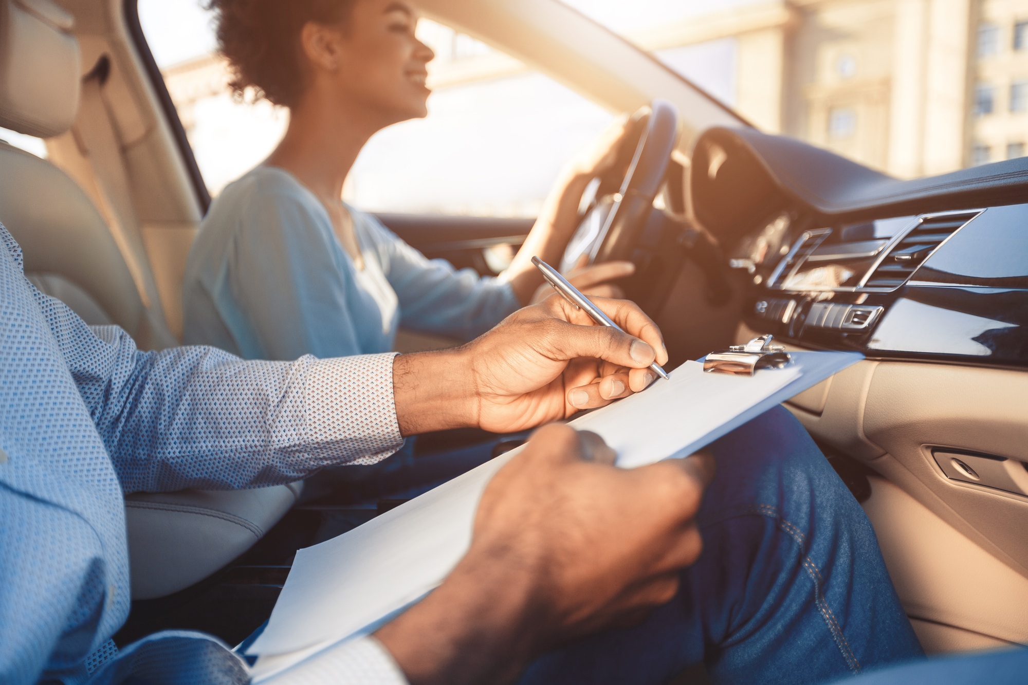 African American Girl Driving Sitting With Instructor In Car, Cropped